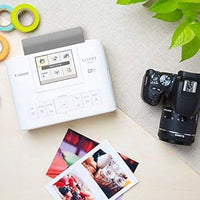 Canon Canon SELPHY CP1300 Compact Photo Printer (White) with WiFi and Accessory Bundle w/Canon Color Ink and Paper Set